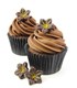 Dark chocolate flower decoration on cupcakes