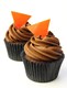 Orange triangle decorations on cupcakes