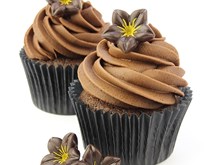 Dark chocolate flower decoration on cupcakes
