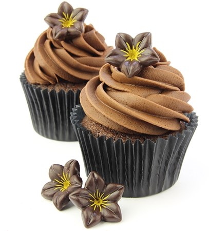 Dark chocolate flower decoration on cupcakes