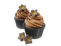 Dark chocolate flower decoration on cupcakes
